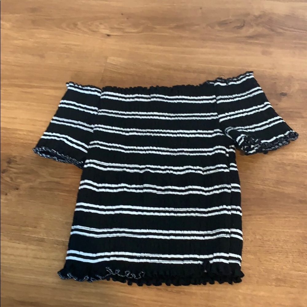 of the shoulder black and white stripped top
